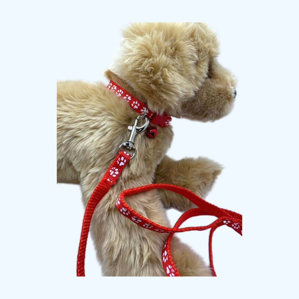 ESSA Collar & Leash Set in Red shown on a small plush dog