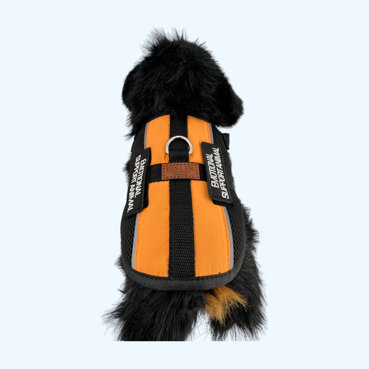 Orange ESSA Harness for Medium and Large overhead view on a black and tan plush dog