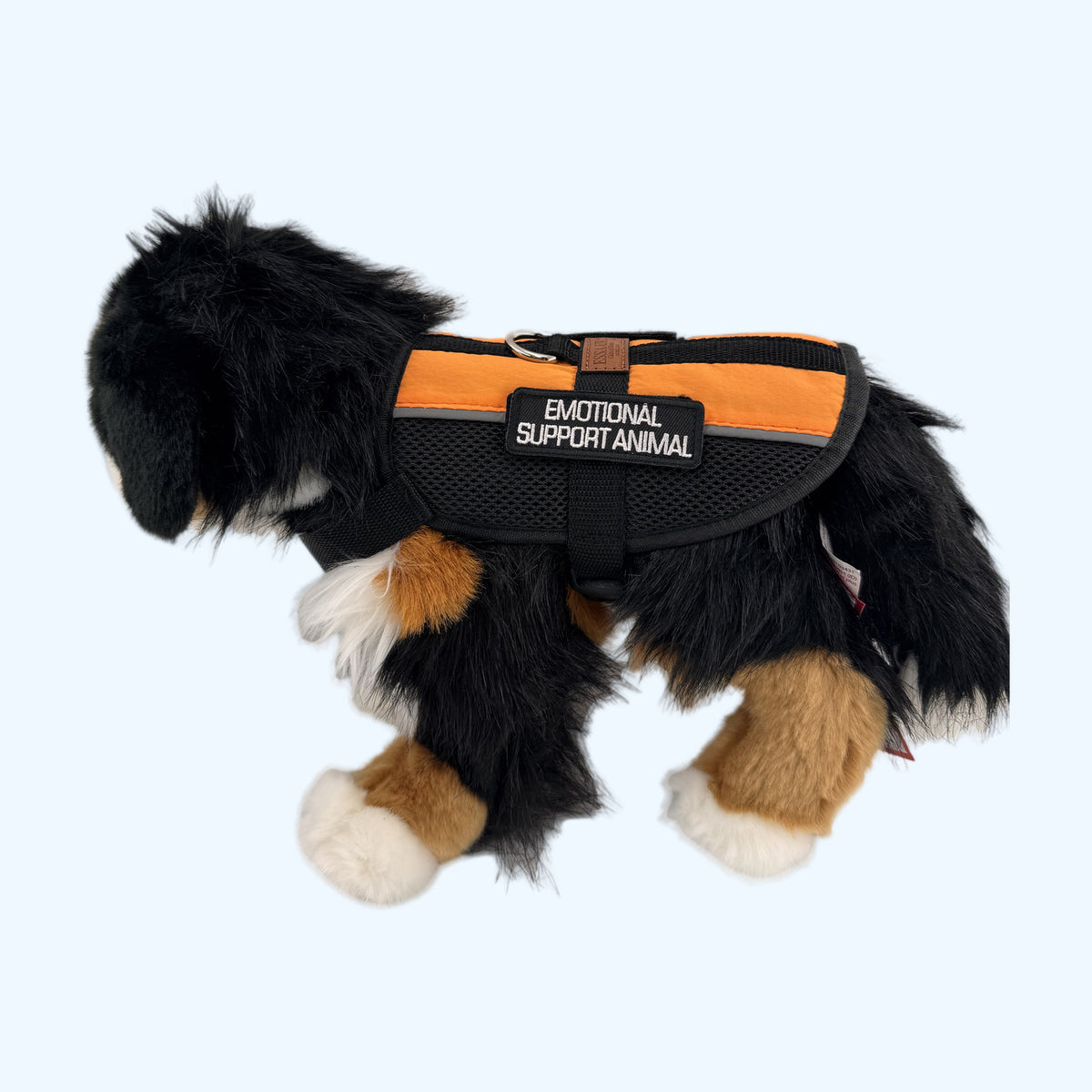 Orange ESSA Harness for Medium and Large worn by a Bernese plush dog, side view