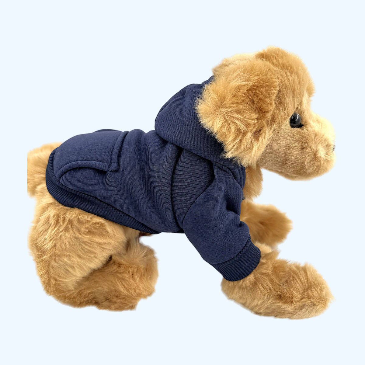 Navy ESSA Hoodie side view with hood down on Medium plush dog