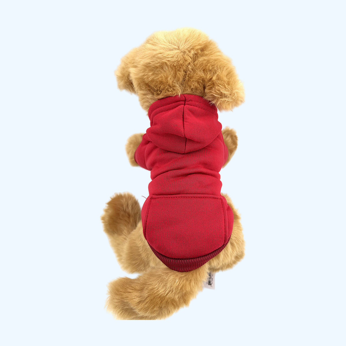 Red ESSA Hoodie from behind showing the hood on a Medium plush dog
