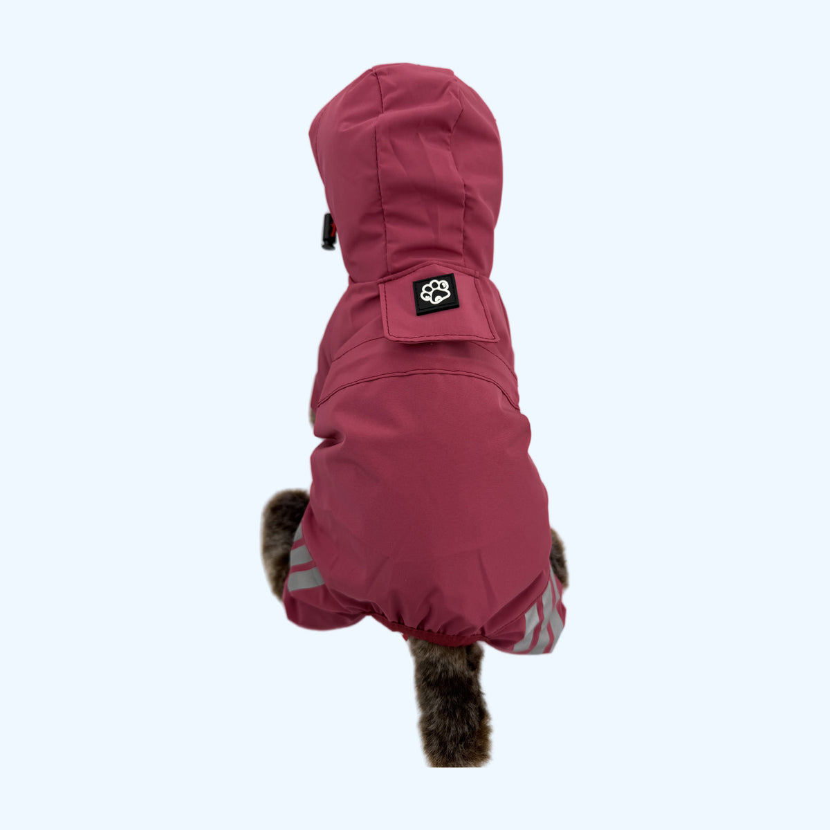 Raspberry ESSA Raincoat from behind with hood, paw patch and reflective stripes