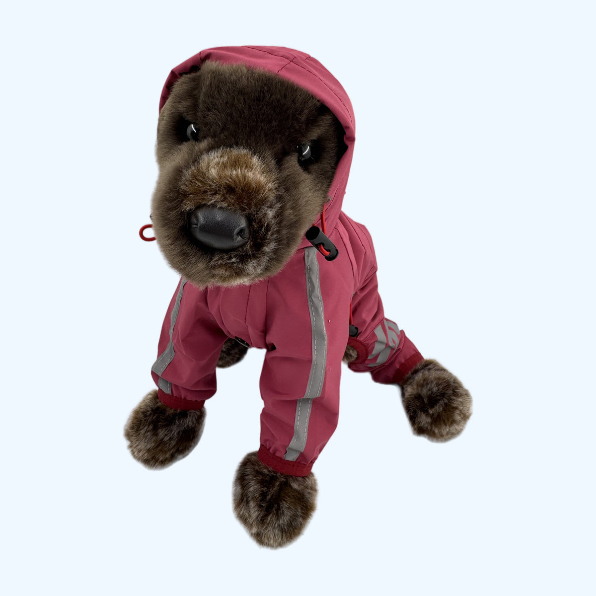 Raspberry ESSA Raincoat drawstring hood framing the face of a Medium plush dog