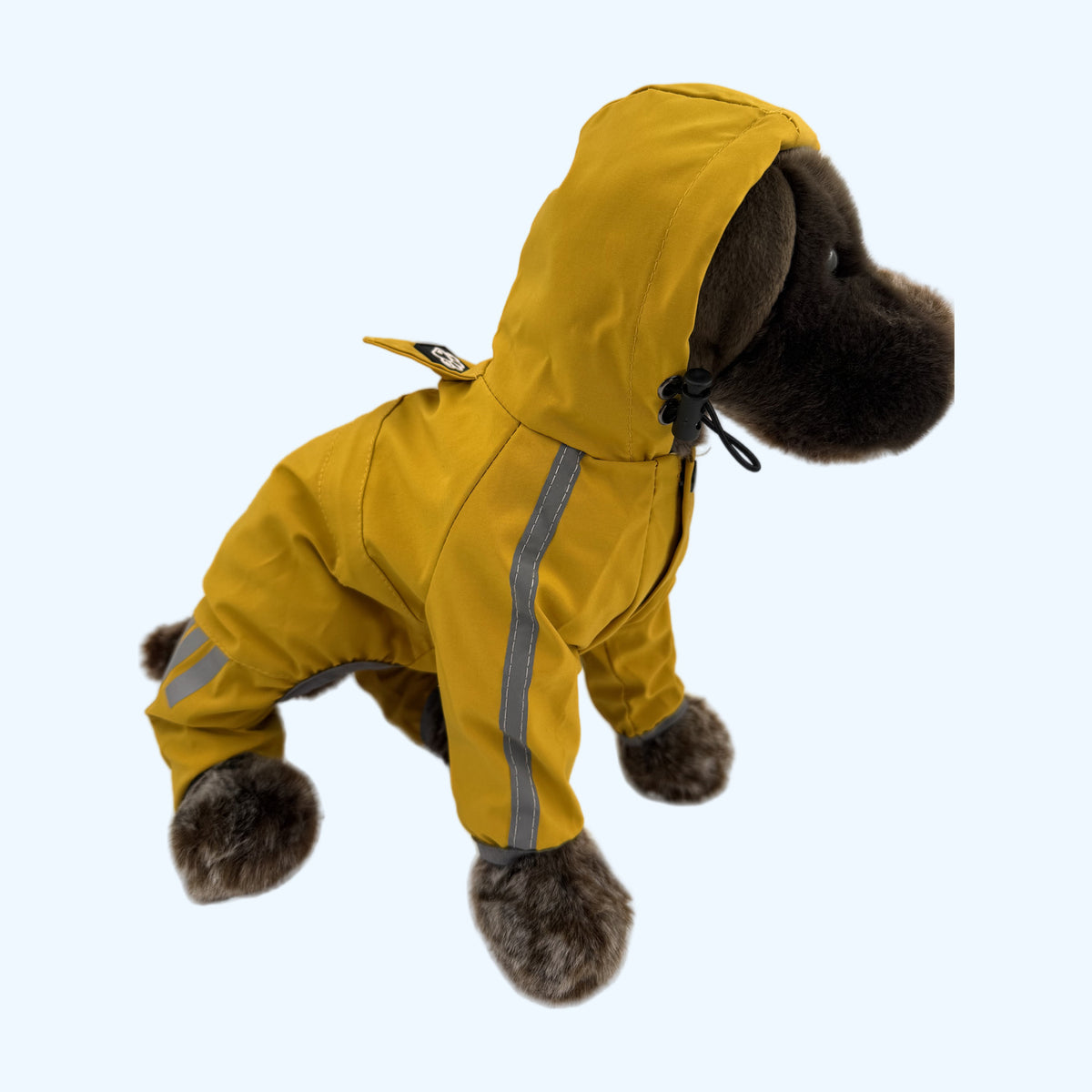 Yellow ESSA Raincoat worn by Medium ESSA plush dog, hood up, front view