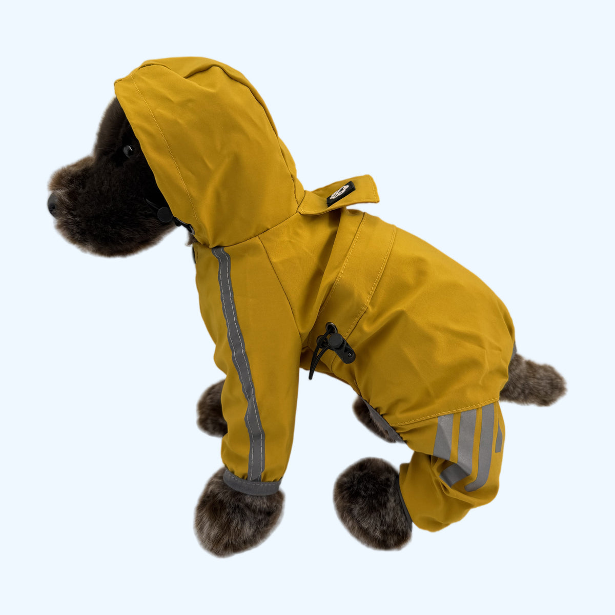 Yellow ESSA Raincoat rear three-quarter view on Medium ESSA plush dog
